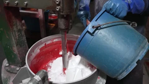 Worker Pouring Red Match Head Compound From Bucket Into Mixing Kettle Vídeo Stock 339736842