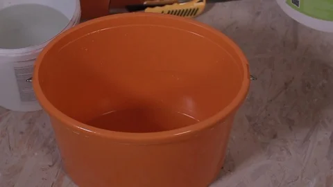 Worker Pouring The Water Into a Plastic Bucket Stock Footage 101317151