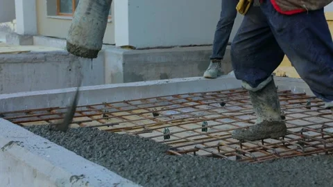 Worker pours concrete on the floor at a construction site Stock Footage 161999363