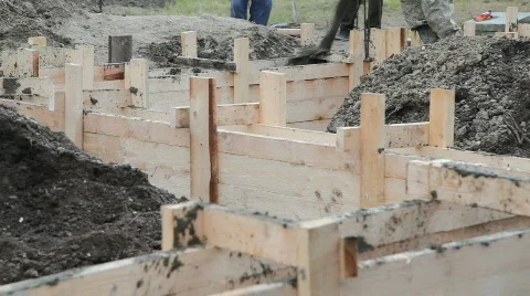 Worker pours the foundation of building Stock Footage 878024