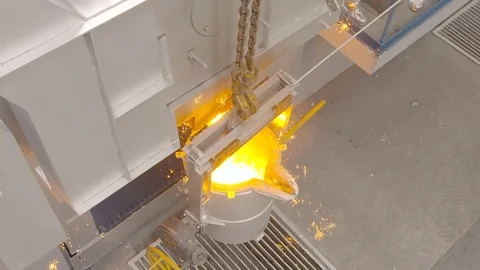 Worker pours molten metal into a container at the metallurgical plant. Stock Footage 76466747