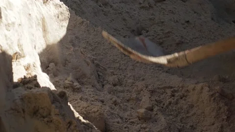 Worker pours sand with a shovel Stock Footage 200204935