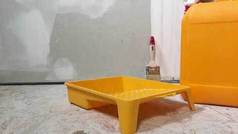 The Worker Pours A White Primer Solution Stock Footage 101388899