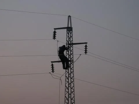 Worker on power line pylon Stock Photos