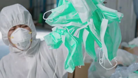 Worker in PPE exhausted and tried in Waste recycling plants during covid-19 a Vídeo Stock 158175283