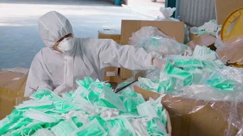 Worker in PPE exhausted and tried in Waste recycling plants during covid-19 a 動画素材 158175498