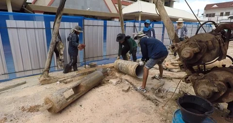 Worker prepare pile construction drilling machine for working Stock Footage 91979260