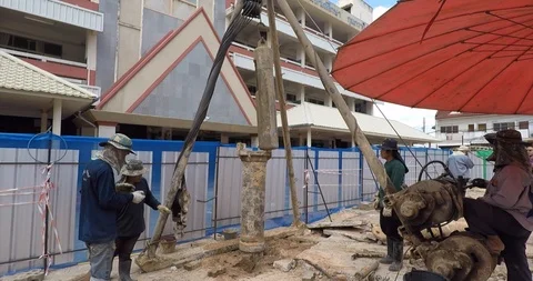 Worker prepare pile drilling machine for working Stock Footage 91878068