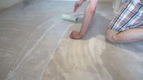 The worker prepares the floor for tiling Stock Footage 74051167