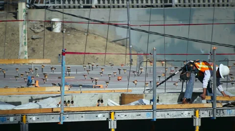 Worker prepares ground zero for development at construction site Stock Footage 34502589