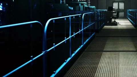 Worker prepares in industrial setting with equipment and blue lights Stock Footage 344971382