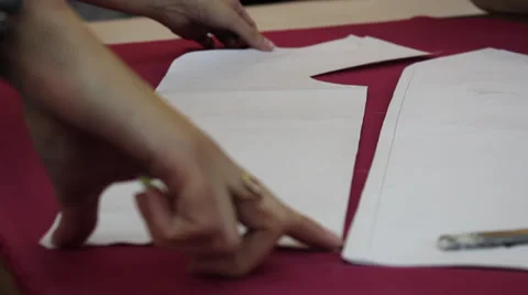 Worker prepares pattern for cutting fabric 5 Stock Footage 33312341