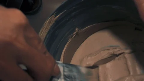 Worker prepares putty for tile Stock Footage 89580334