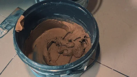 Worker prepares putty for tile Video stock 89580748