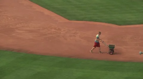 Worker preparing baseball diamond for gameplay Stock Footage 56947339