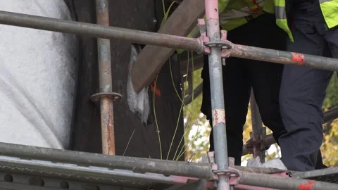 Worker Preparing Explosive Charge for Bridge Demolition Stock-Footage 343658739