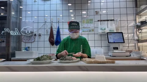Worker preparing handmade dumplings with minced pork and vegetable filling Stock Footage 347132290