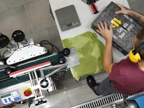 Worker preparing a package for shipment in a brewery Stock Photos