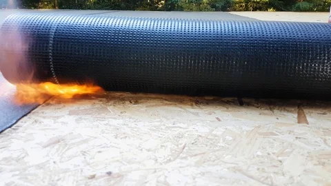Worker Preparing Part Of Bitumen Roofing Felt Roll Stock Footage 88823197