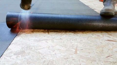 Worker Preparing Part Of Bitumen Roofing Felt Roll Video stock 88823337