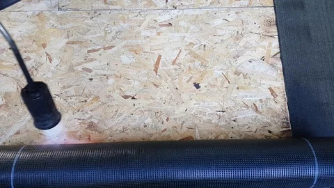 Worker Preparing Part Of Bitumen Roofing Felt Roll Stock Footage 88823362