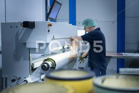 Worker Preparing Printing Plates In Food Packaging Printing Factory