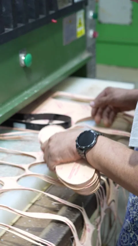 Worker Press Cuts Repeated Footwear Parts in Factory Vertical Vidéo 340182774