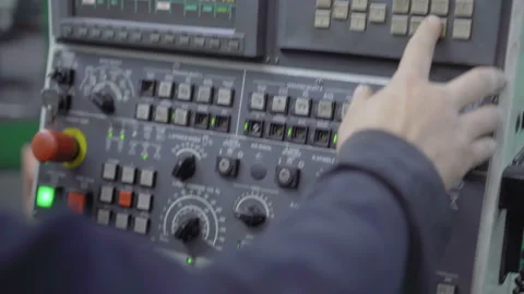 The worker presses the buttons of the old control panel with the display 스톡 동영상 113382737