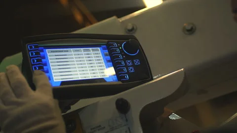 Worker presses keys on control panel of boom lift truck Stock Footage 157288004