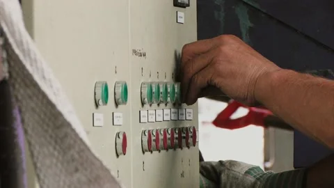 Worker presses the red and green buttons on factory Stock Footage 91331073