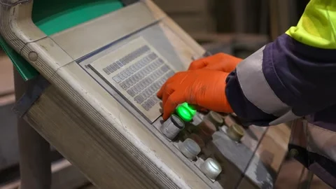 Worker pressing industrial buttons controller heavy machinery Stock Footage 256149828