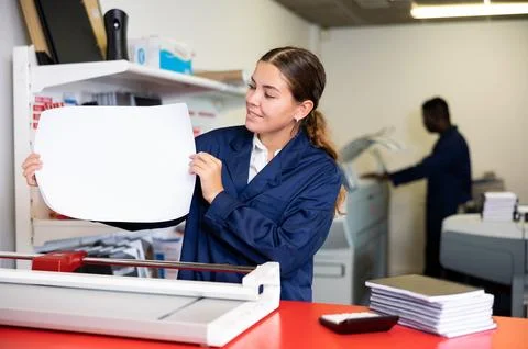 Worker in printing and press centar check print quality Stock Photos