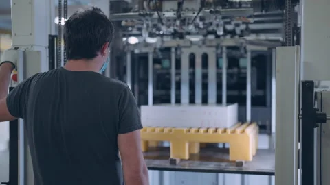 A worker in a printing house prepares printing material. Stock Footage 197463592