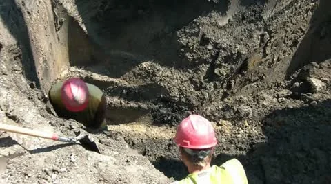 Worker Probing Ground in Hole Video stock 12617157
