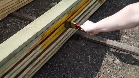 The worker processes the Board with a brush Stock Footage 107789603