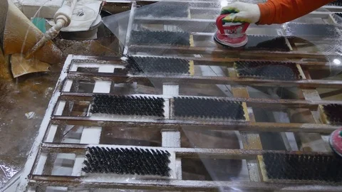 The worker processes the edge of the glass in the diamond circle. Stock Footage 121872219
