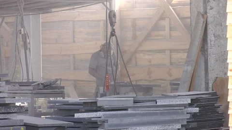 The worker processes the granite stone with a grinder Stock Footage 111244280