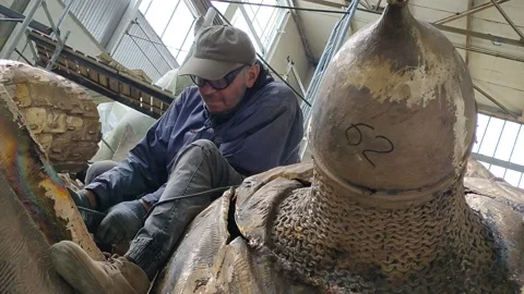 A worker processes a monument to Alexander Nevsky in the studio Stock Footage 157781323