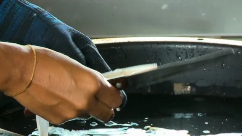 A worker processing a raw fish Stock Footage 120021709