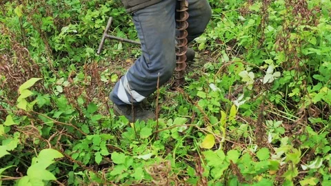Worker produces drilling to test soil before installing the base. Construction. Video stock 71270498