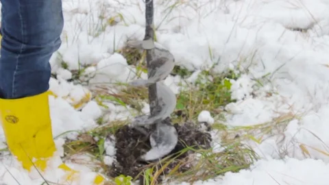 Worker produces drilling to test soil before installing the base. Construction. Video stock 72375050