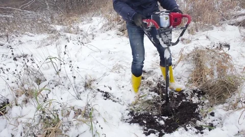 Worker produces drilling to test soil before installing the base. Construction. Video stock 72375773