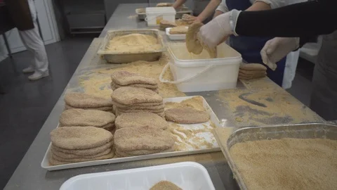 Worker produces schnitzels  in meat processing factory Stock Footage 124313341