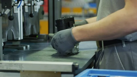 Worker in Production Plant - Handicraft assembly line Stock Footage 98692453