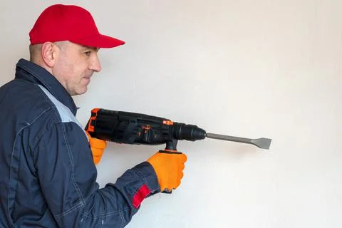 Worker, professional with hammer drill, perforator Stock Photos