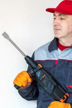 Worker, professional with hammer drill, perforator Stock Photos