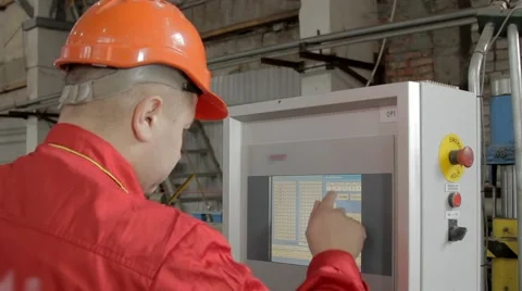 Worker is programing a machine 스톡 동영상 62872204