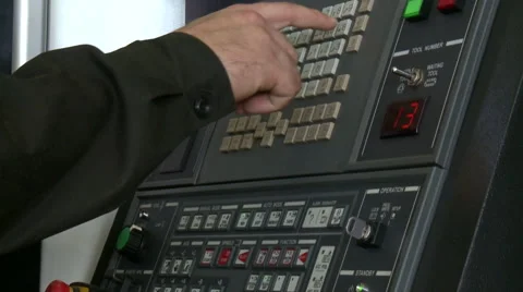 Worker programming a CNC machine. 스톡 동영상 64768509