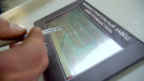 Worker is programming CNC Machine Stock Footage 231509621