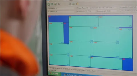 Worker programs the machine for cutting glass Stock Footage 40541327